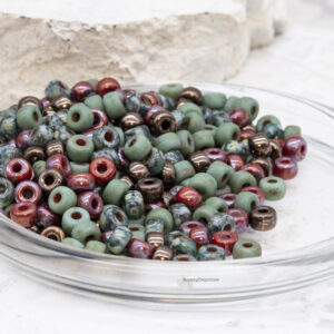 2/0 Czech Matubo seed beads in berry tones of red, green, earthy brown, and natural garden hues