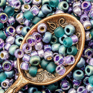 6/0 seed bead mix in dragonfly dreams colors featuring mixed brand glass beads in purple, teal, green, and blue tones