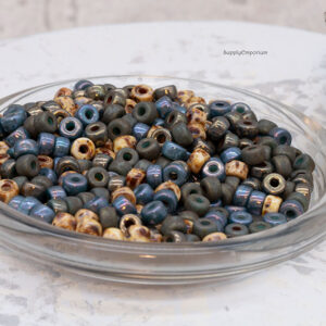 2/0 Czech Matubo seed beads in muted earth tones of brown, gray, blue, and natural rustic hues