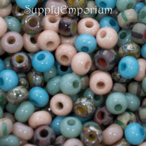 6/0 Czech seed bead mix in soft earthy colors featuring beige, tan, blue, cream, and muted natural tones