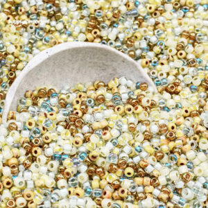 8/0 seed bead mix in sandy shore colors featuring beige, tan, cream, gold, and soft coastal tones