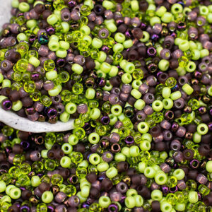 8/0 seed bead mix in grapes colors featuring purple, green, and earthy tones