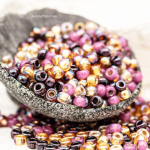6/0 Miyuki seed beads in black, gold, pink, and iridescent evening tones