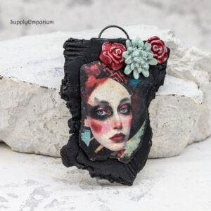 handmade polymer clay face pendant with 3D flower embellishment