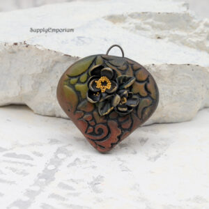 polymer clay floral teardrop pendant with raised flower details