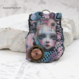 polymer clay fairy pendant with layered image transfer and metal gear embellishment