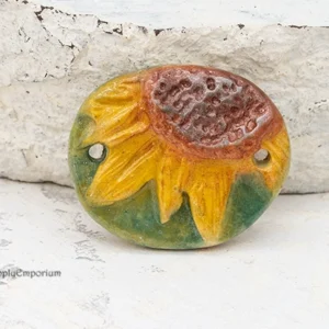 handmade polymer clay 2-hole sunflower connector with raised stamped design