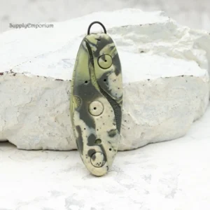 handmade olive green polymer clay pendant made with mokume gane technique and black iron bail loop
