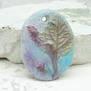 polymer clay floral pendant oval raised stamped two sided handmade pendant turquoise