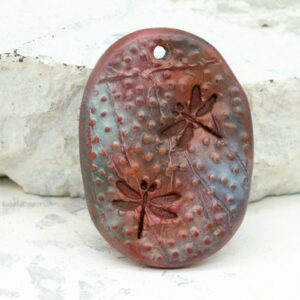 polymer clay floral pendant oval raised stamped two sided handmade pendant teal rust